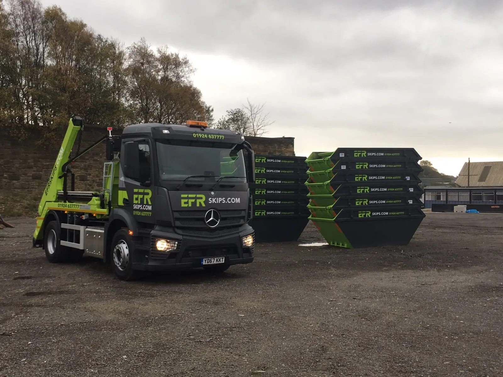 Empty skips stacked several high awaiting their next hire